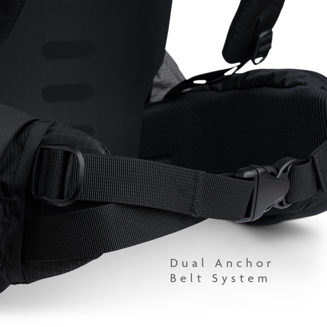 Close-up of the Shadowlight 60 backpack hip belt buckle and strap cinch system for adjusting fit and load distribution.