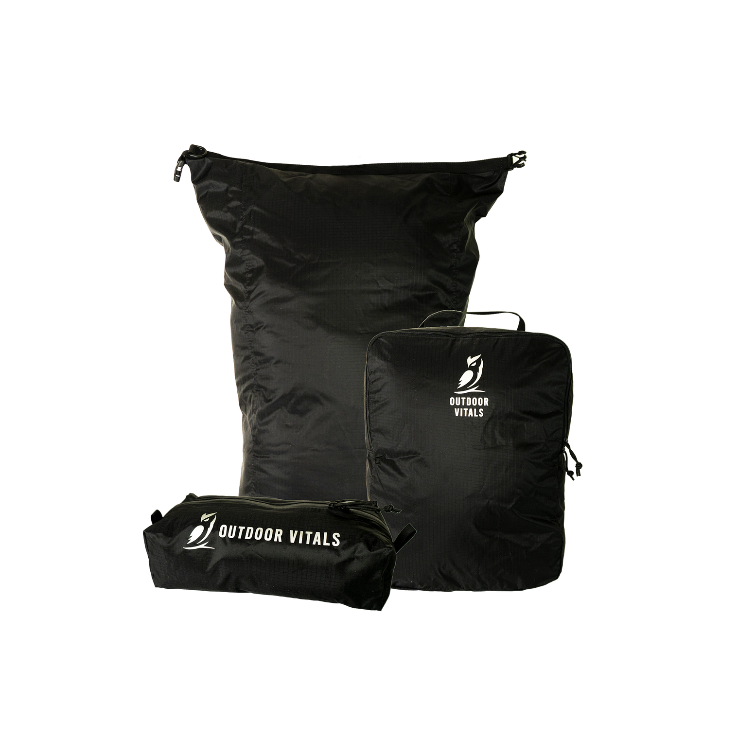 Product shot featuring Outdoor Vitals ultralight travel organization accessories, including a dry bag, a packing cube, and a zippered dopp kit pouch.