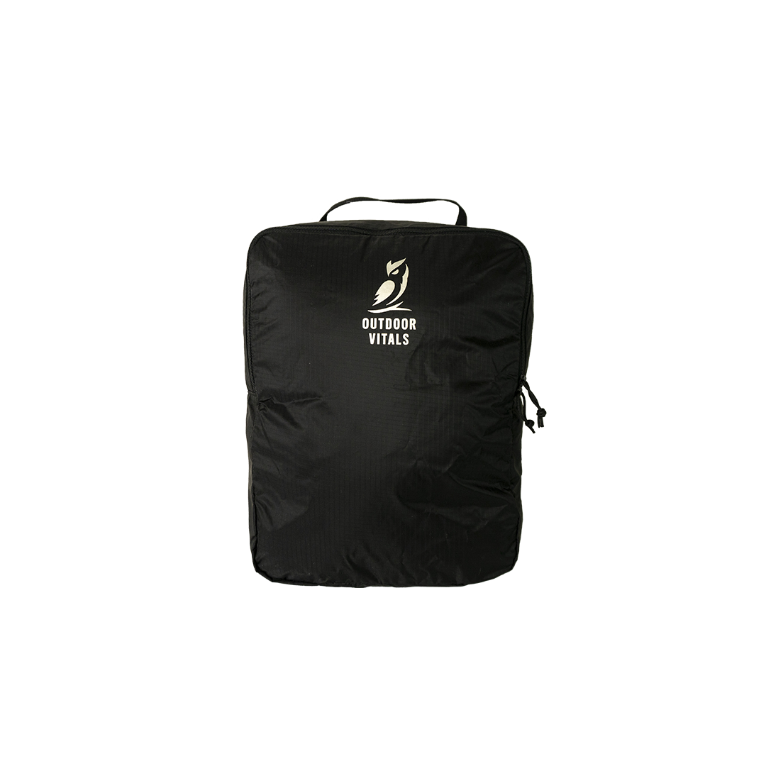 Studio product front view of the Outdoor Vitals OV Cube packing accessory for the KotaUL Travel & Adventure Backpack, featuring top grab handle and printed logo.