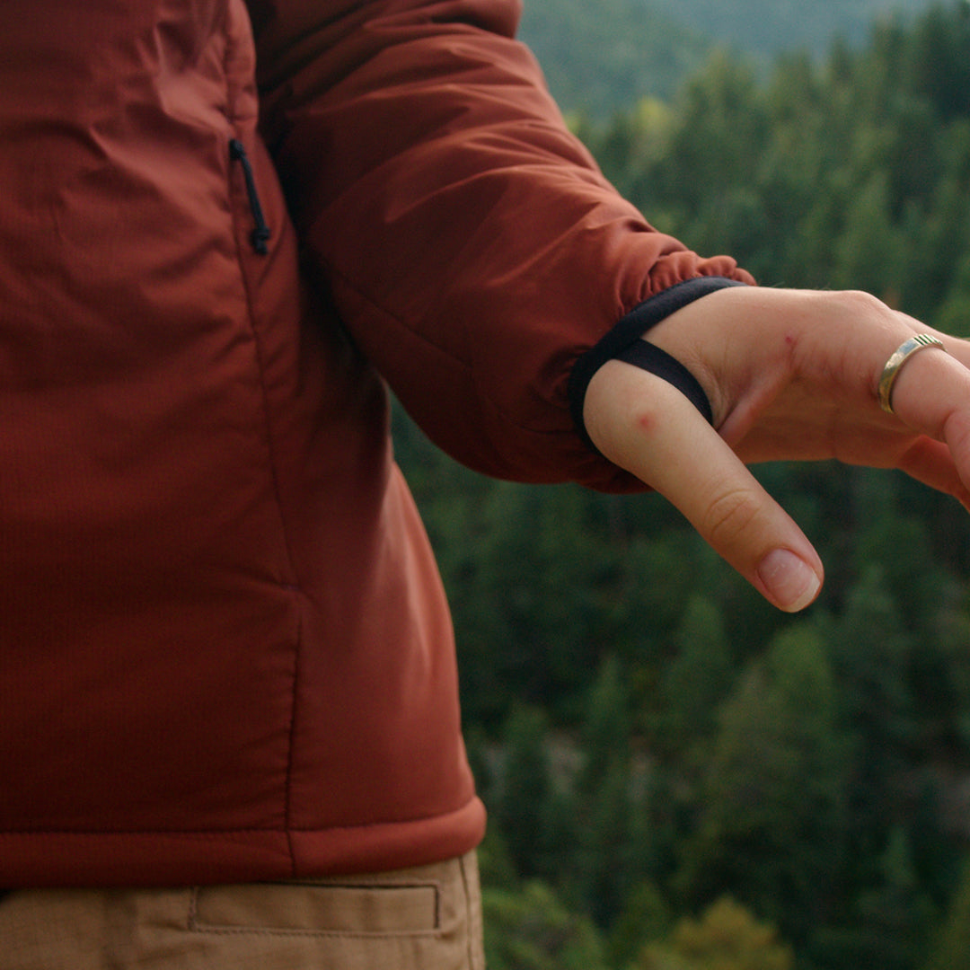 Close-up of the Outdoor Vitals Vario Jacket sleeve showing the integrated thumb loop