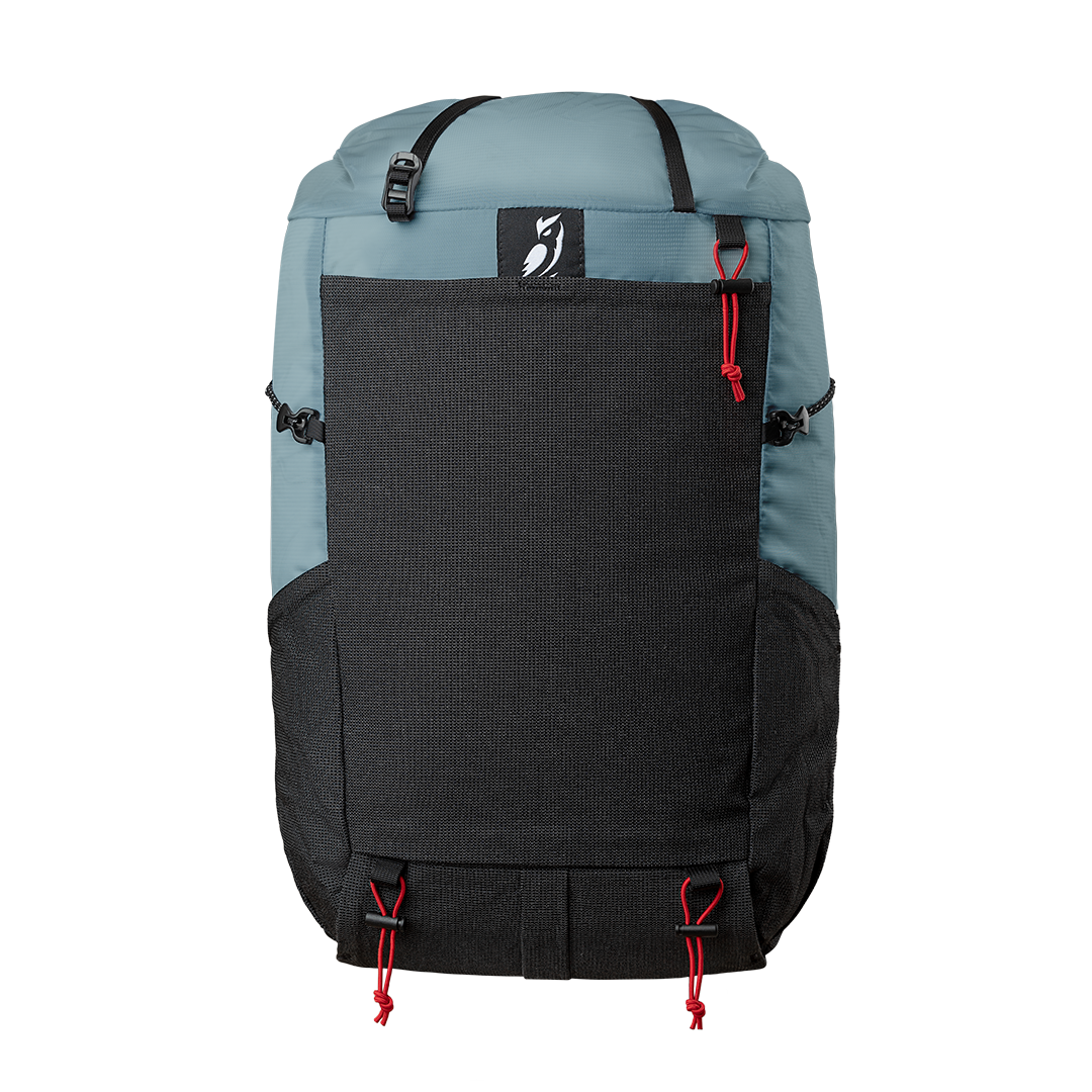 Front view of the Outdoor Vitals Skyline 30 Fastpack with stretch-mesh pocket.