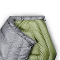 Close-up of a backpacking quilt showing the unique taper that causes the quilt to wrap naturally around your shoulders.