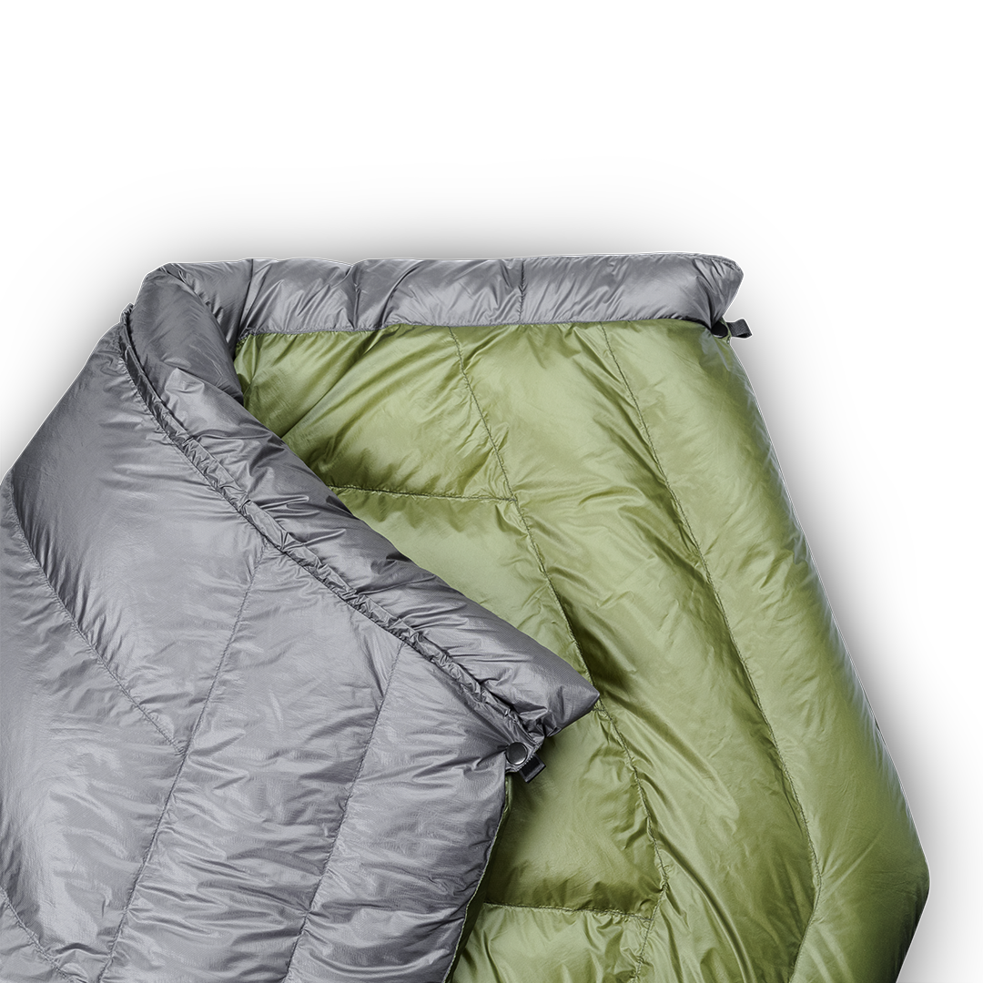 Close-up of a backpacking quilt showing the unique taper that causes the quilt to wrap naturally around your shoulders.