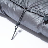 Close-up view of the adjustable drawstring cord lock on the top neck collar of the Outdoor Vitals StormLoft Down TopQuilt.