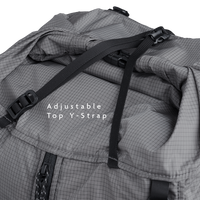Close-up of the Outdoor Vitals Shadowlight backpack’s roll-top closure with adjustable top strap and buckle for secure compression.