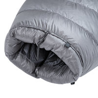 Detailed view of the cinched top neck collar with adjustable cord lock and insulated draft baffle on the red Outdoor Vitals StormLoft Down TopQuilt.