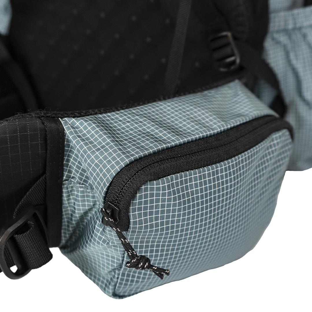 Side profile of the Shadowlight Ultralight Backpack highlighting its spacious hip belt pockets