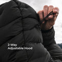 Close-up of a person wearing a black puffer jacket with an adjustable hood, pulling the hood strap. White text on the image reads '2-Way Adjustable Hood'.