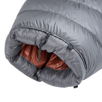 Detailed view of the cinched top neck collar with adjustable cord lock and insulated draft baffle on the red Outdoor Vitals StormLoft Down TopQuilt.