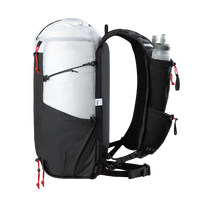 Side profile view of the Outdoor Vitals Skyline 30 Fastpack showing the vest-style harness loaded with a soft flask, side compression cords, mesh side pocket, and roll-top main compartment.