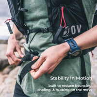Close view of hiker adjusting harness of fastpack. Text callout says, "Stability In Motion - built to reduce bouncing, chafing, & rubbing on the move."