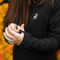 Thumb loops on woman's hands