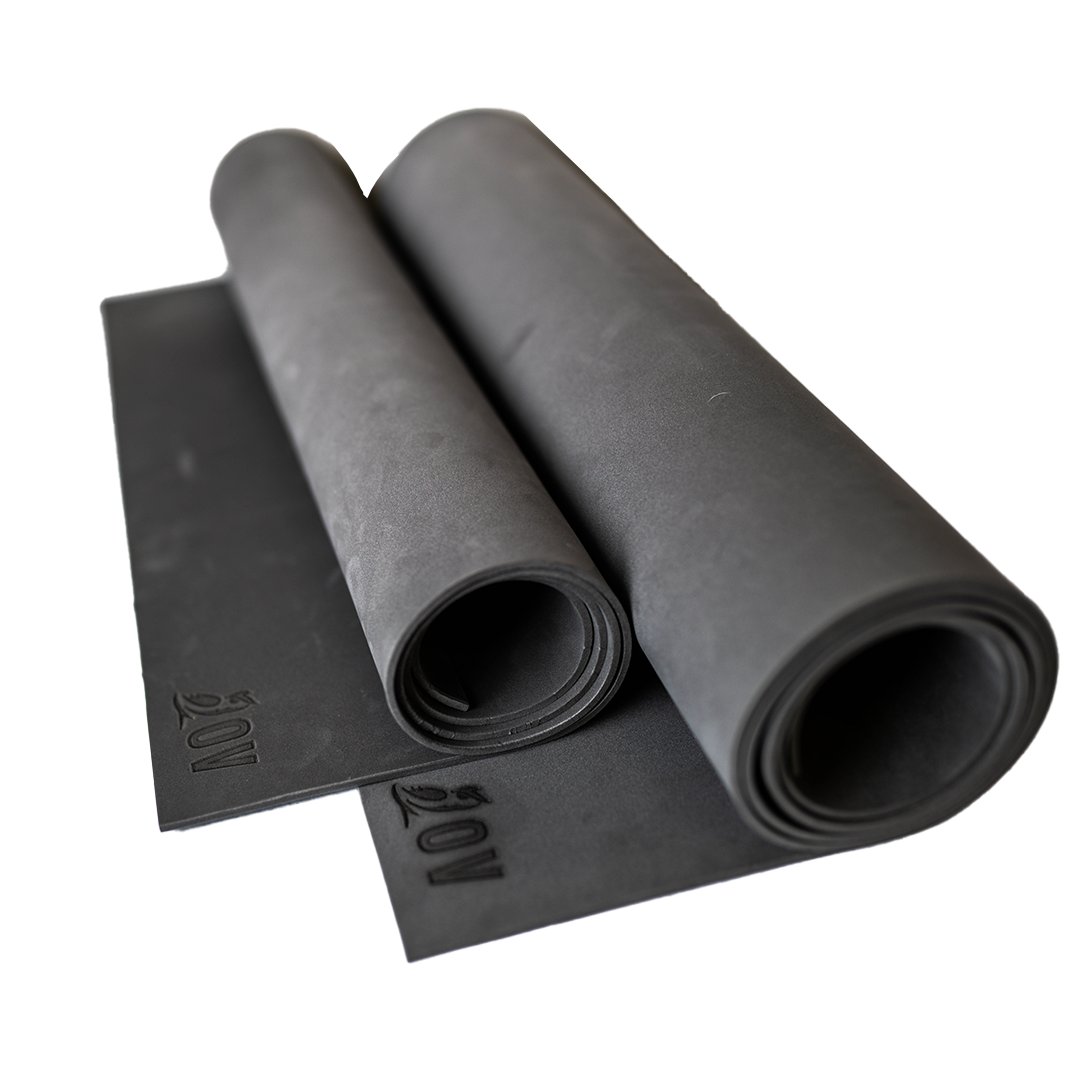 side view of 2 closed cell foam sleeping pads that are rolled up