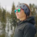 woman looking to the side outdoors while wearing a Ventus Active Hoodie