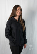Woman wearing a full zipped hoodie jacket 45 degree angle front view