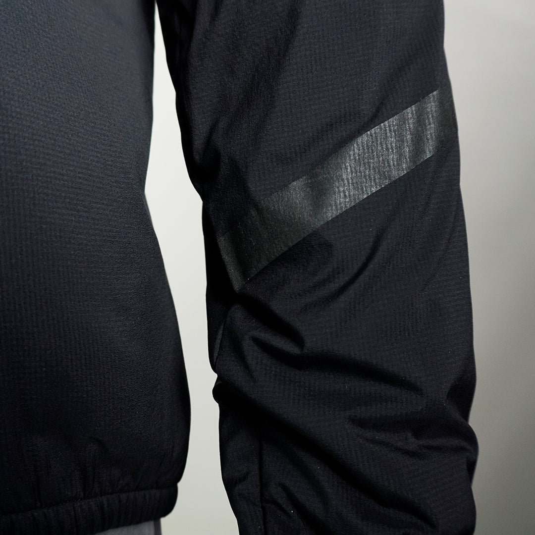 Close-up shot of the clear reflective sleeve mark on Ventus Active hoodie