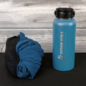 Packed Outdoor Vitals Ventus Active hoodie Jacket beside a water bottle for size comparison