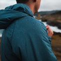 Close-up of water droplets beading on the fabric of a Ventus Active Hoodie to show water resistance.